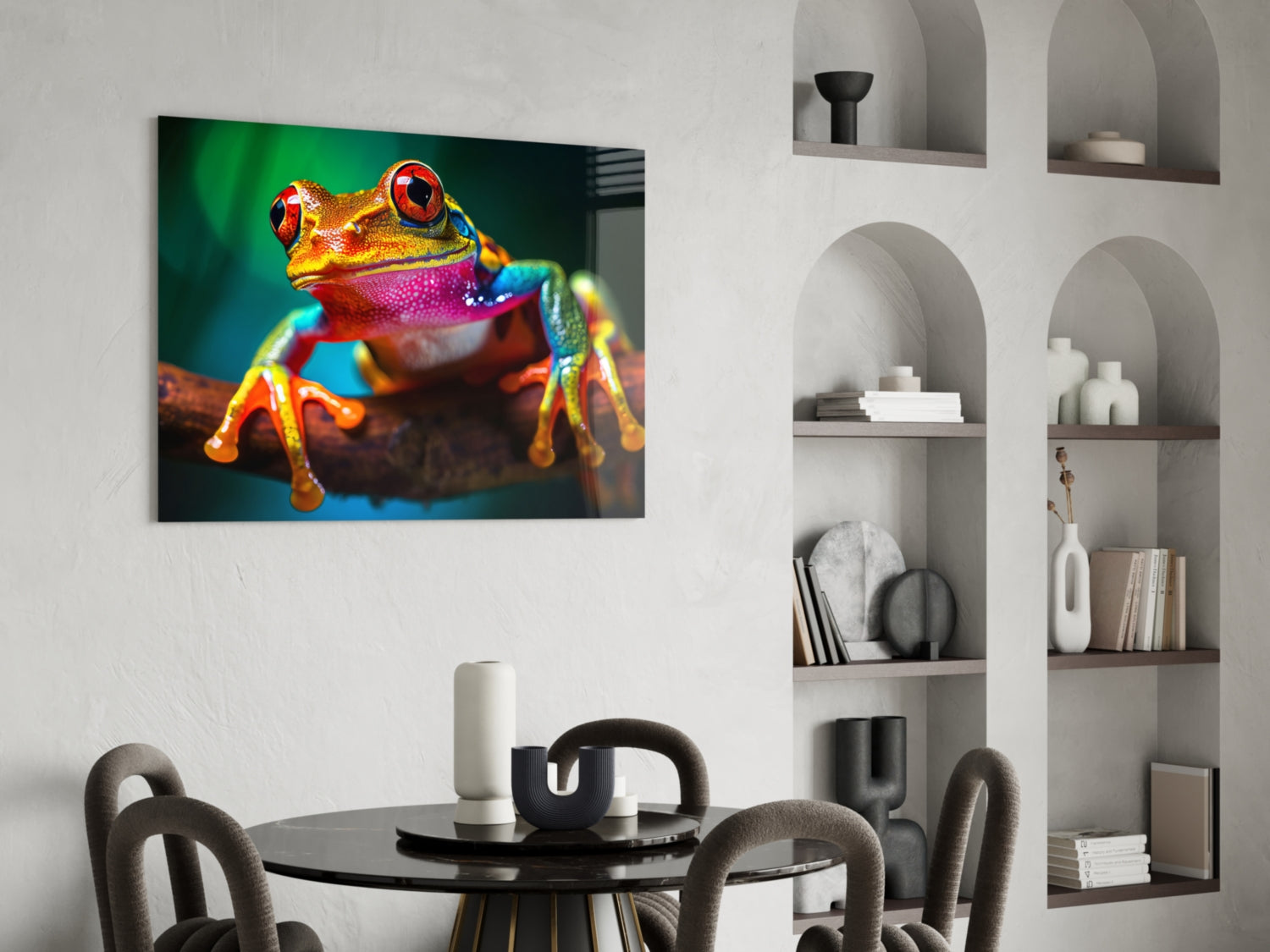 Vibrant glass wall art depicting a colorful red-eyed tree frog in yellow, pink, and blue tones displayed in a modern dining room setting.