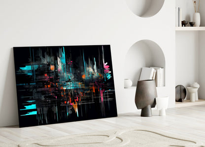 Modern minimalist interior with abstract digital art glass panel featuring cyan, orange, and pink neon streaks on black background, leaning against white wall beside sculptural ceramics.