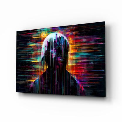 Angled perspective of glass wall art displaying a glowing silhouetted head with vibrant neon streaks in cyan, magenta, orange, and yellow against black background.