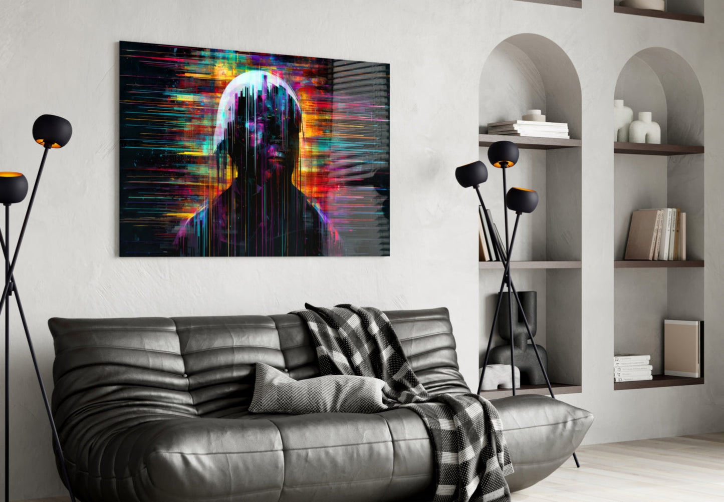 Colorful digital art glass panel depicting an abstract figure with neon pink, yellow, and cyan glitch effects hanging above a black leather sofa in a modern living room.