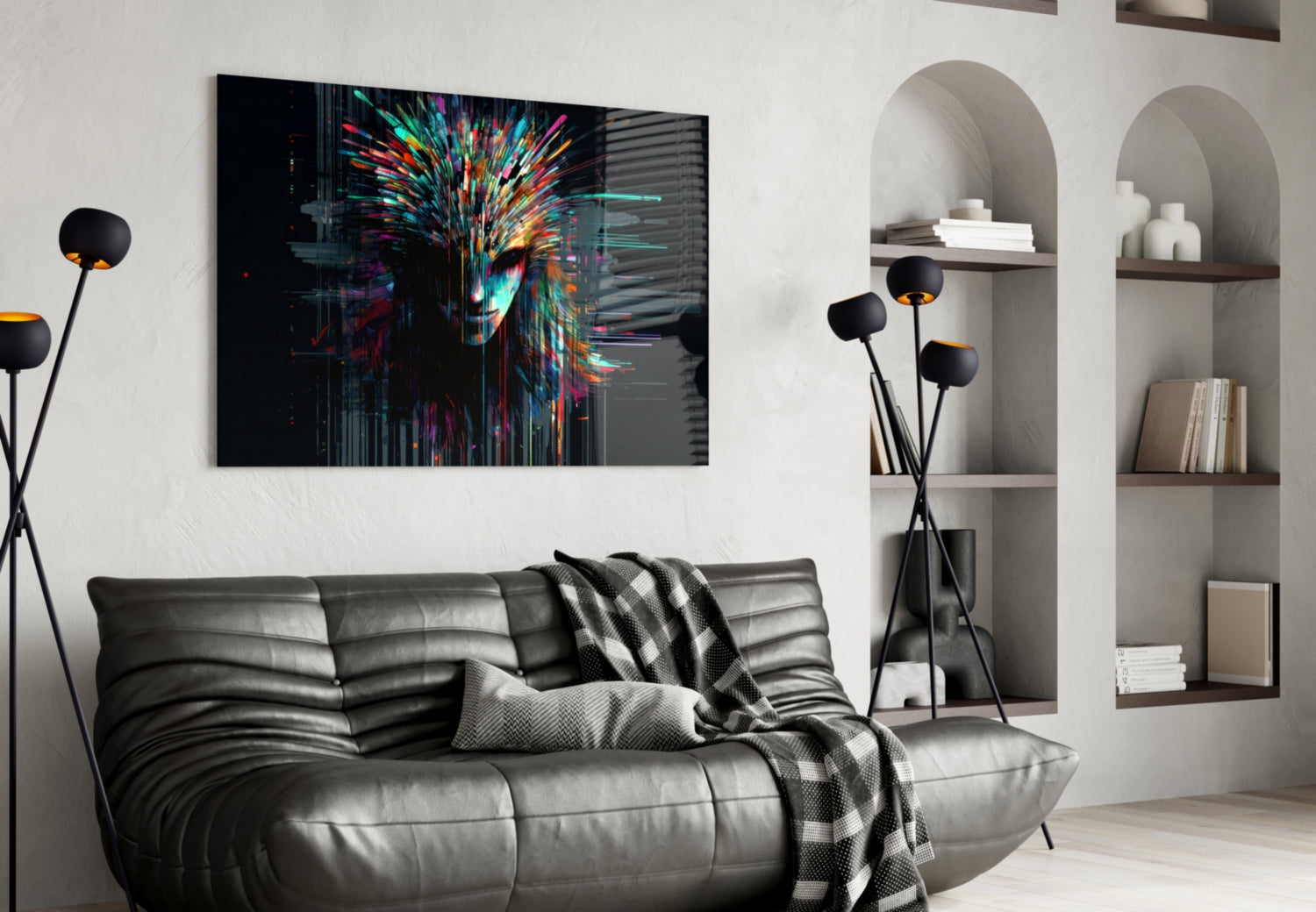 Colorful digital face artwork with neon streaks displayed above gray leather sofa in modern living room interior.