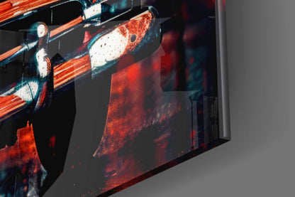 Angled view of vintage car glass wall art displaying red and white classic automobiles with orange striping against dark background.