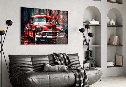 Vintage red American car glass wall art displayed above a black leather sofa in a modern living room with white shelving.
