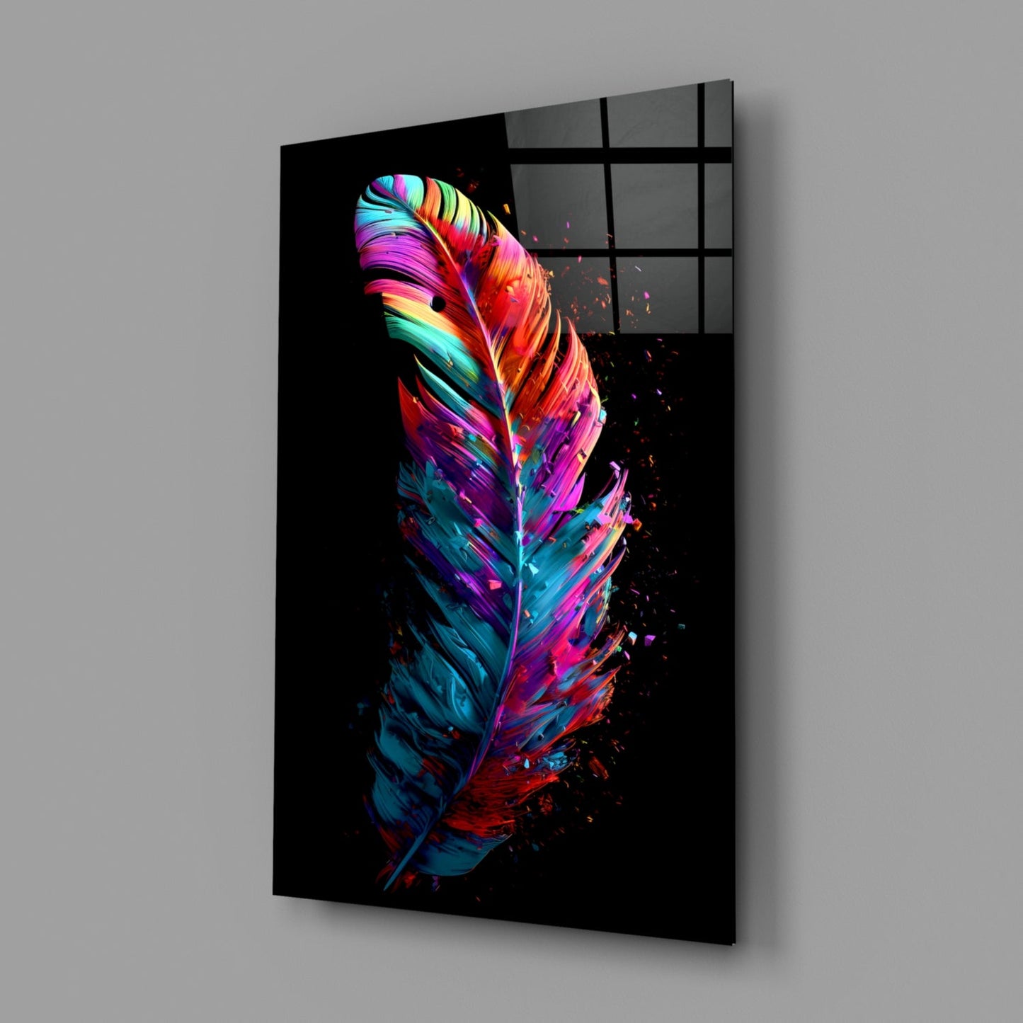 Angled perspective view of vibrant neon feather glass wall art on black background, showing colorful gradient stripes in pink, blue, yellow, and red with particle effects.
