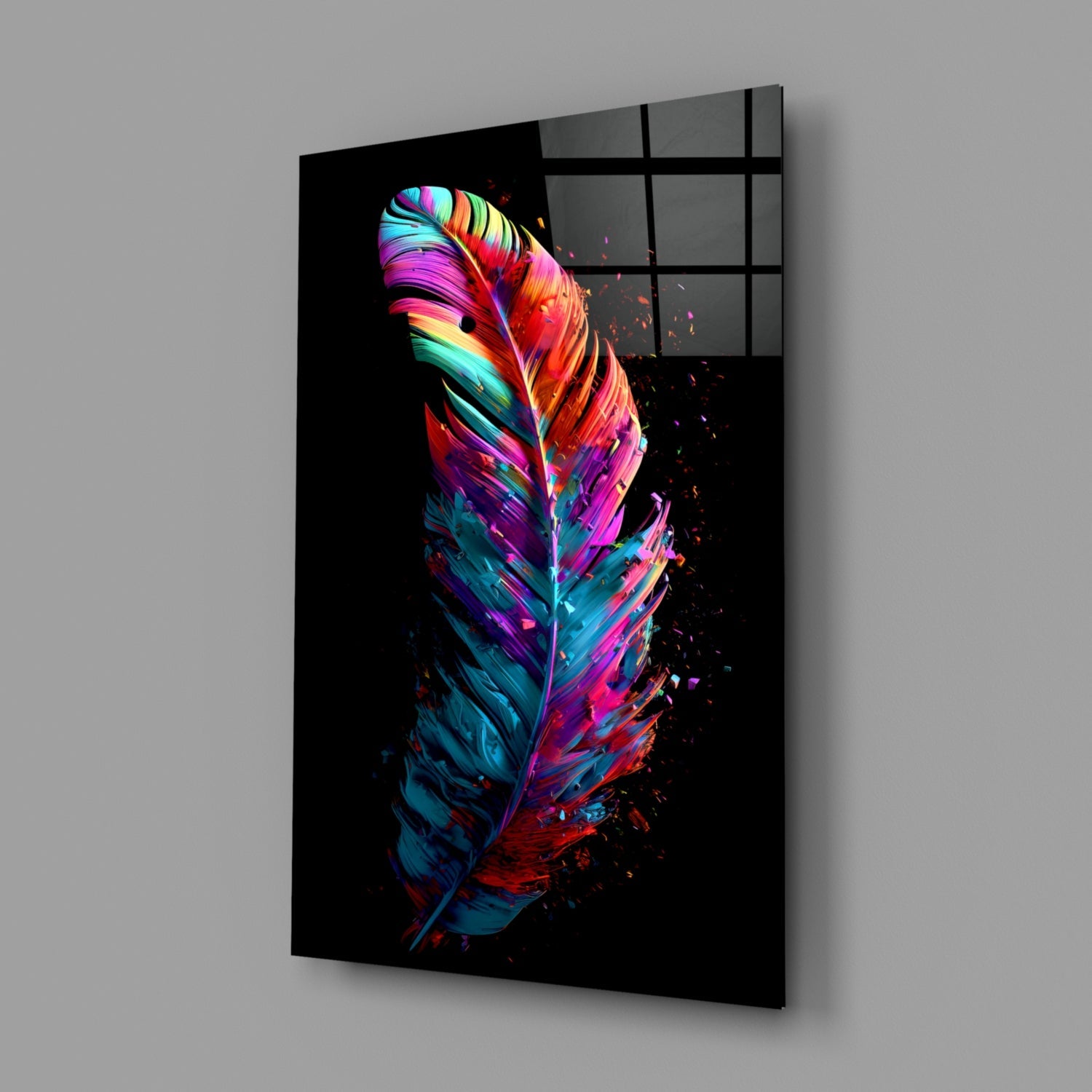 Angled perspective view of vibrant neon feather glass wall art on black background, showing colorful gradient stripes in pink, blue, yellow, and red with particle effects.