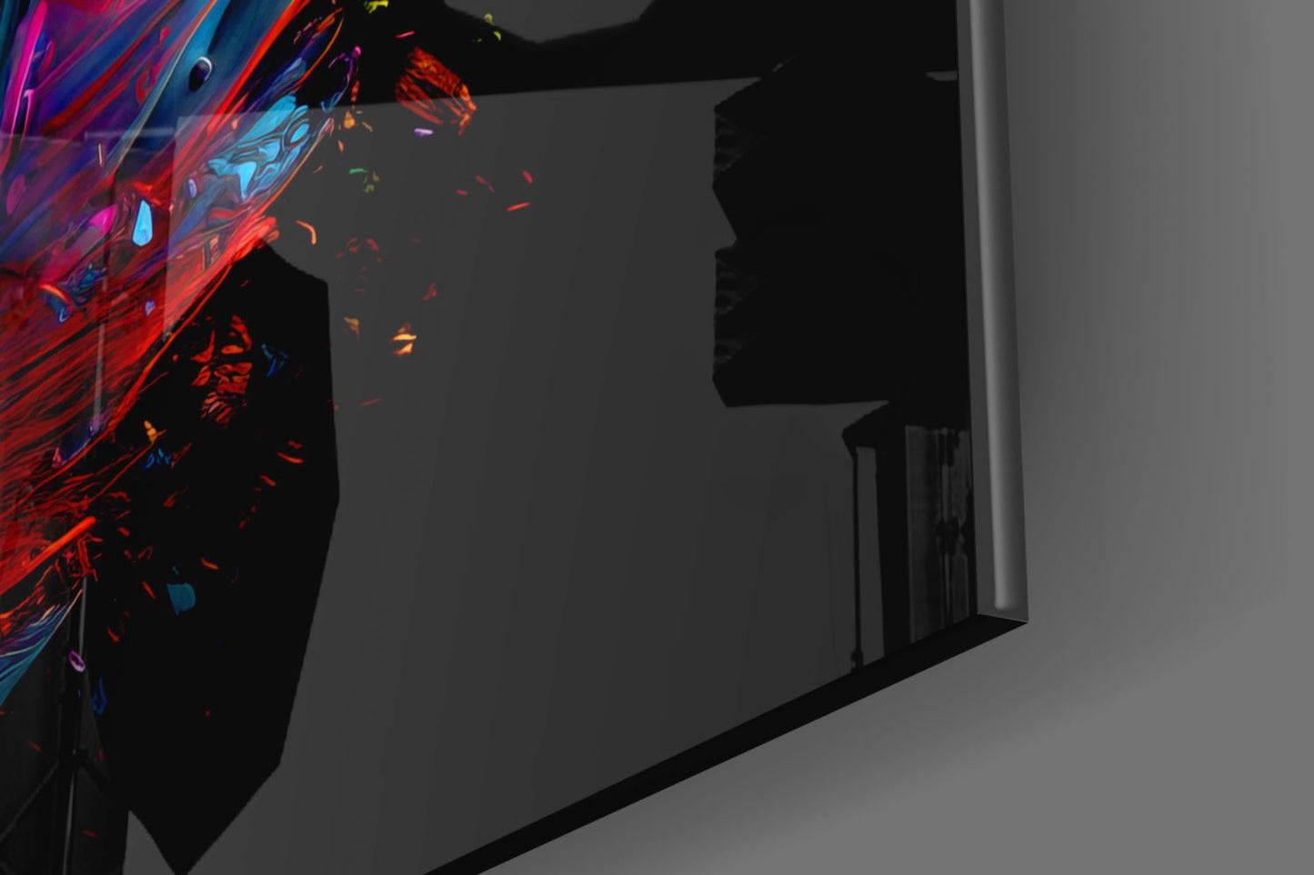 Vibrant red and blue feather glass wall art installed on dark interior wall beside doorway, displaying dynamic color gradient.