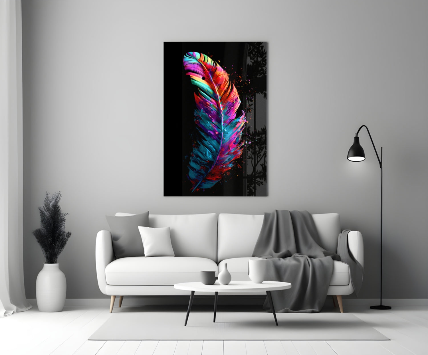 Vibrant multicolored feather glass wall art with neon pink, blue, and yellow stripes hanging above a white sofa in a minimalist living room.