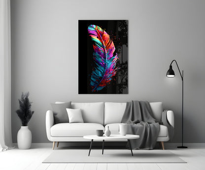 Vibrant multicolored feather glass wall art with neon pink, blue, and yellow stripes hanging above a white sofa in a minimalist living room.
