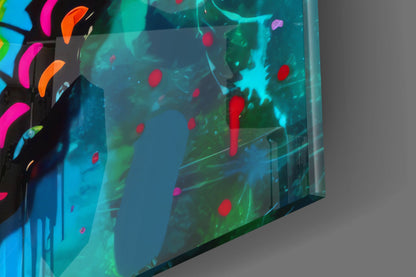 Angled side view of illuminated glass wall art displaying colorful red, cyan, and green floating particles against dark background with neon accent lighting on left edge.