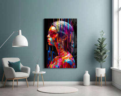 Colorful abstract portrait glass wall art displayed in a modern living room with teal walls, white chair, and potted plants.
