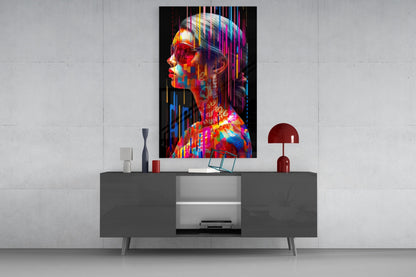 Colorful neon portrait glass art displayed above gray media console with red lamp and decorative accessories in modern living room setting.