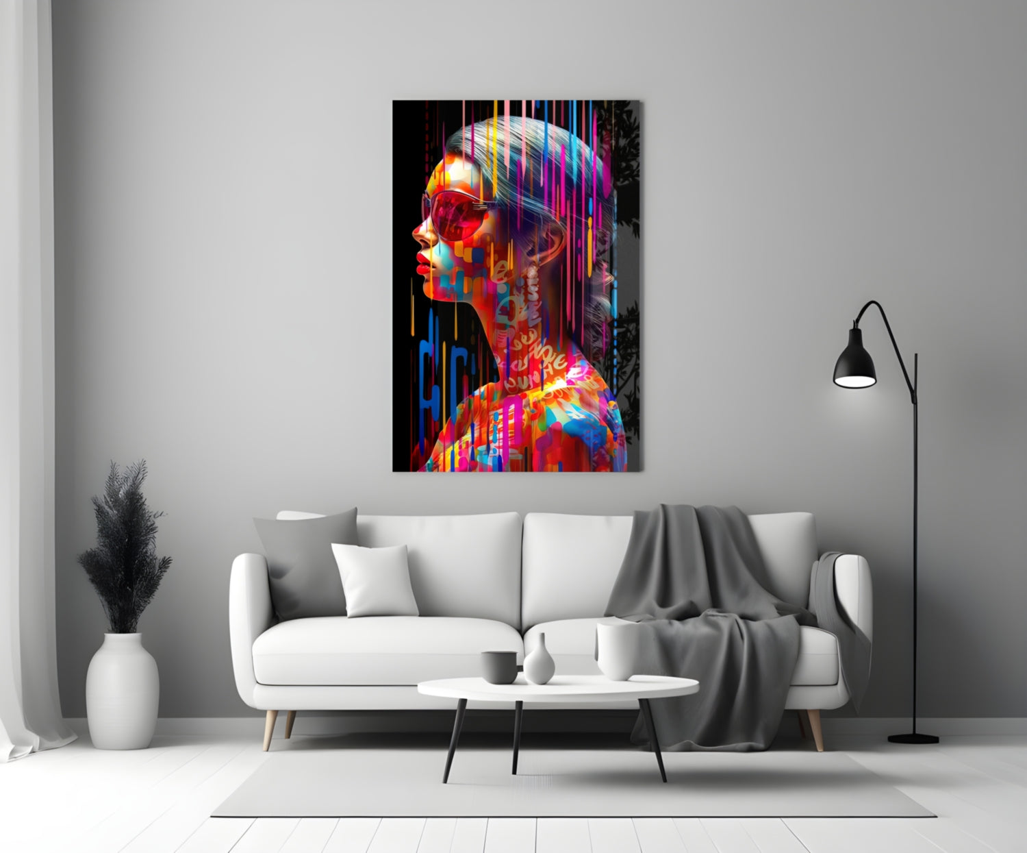 Colorful neon-style glass wall art depicting a profile portrait with rainbow stripes displayed above a white sofa in a minimalist living room.
