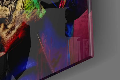 Illuminated glass wall art panel displaying colorful projected imagery of a monkey figure with green, red, and blue light effects in an interior space.