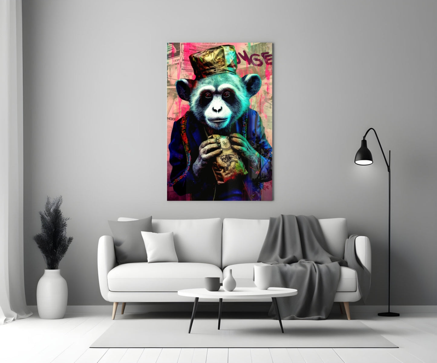 Colorful glass wall art depicting a stylized turquoise monkey wearing a crown and blue jacket, holding a golden object, displayed above a white sofa in a modern living room.