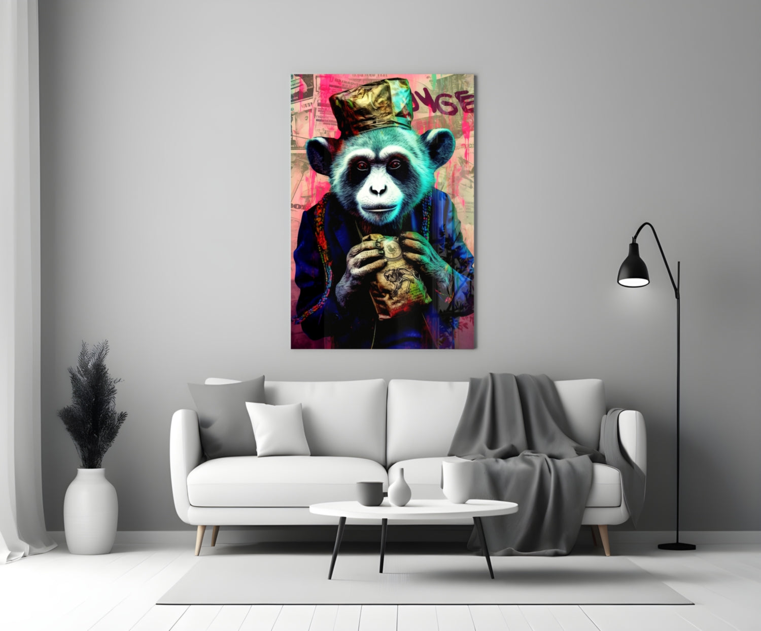 Colorful glass wall art depicting a stylized turquoise monkey wearing a crown and blue jacket, holding a golden object, displayed above a white sofa in a modern living room.