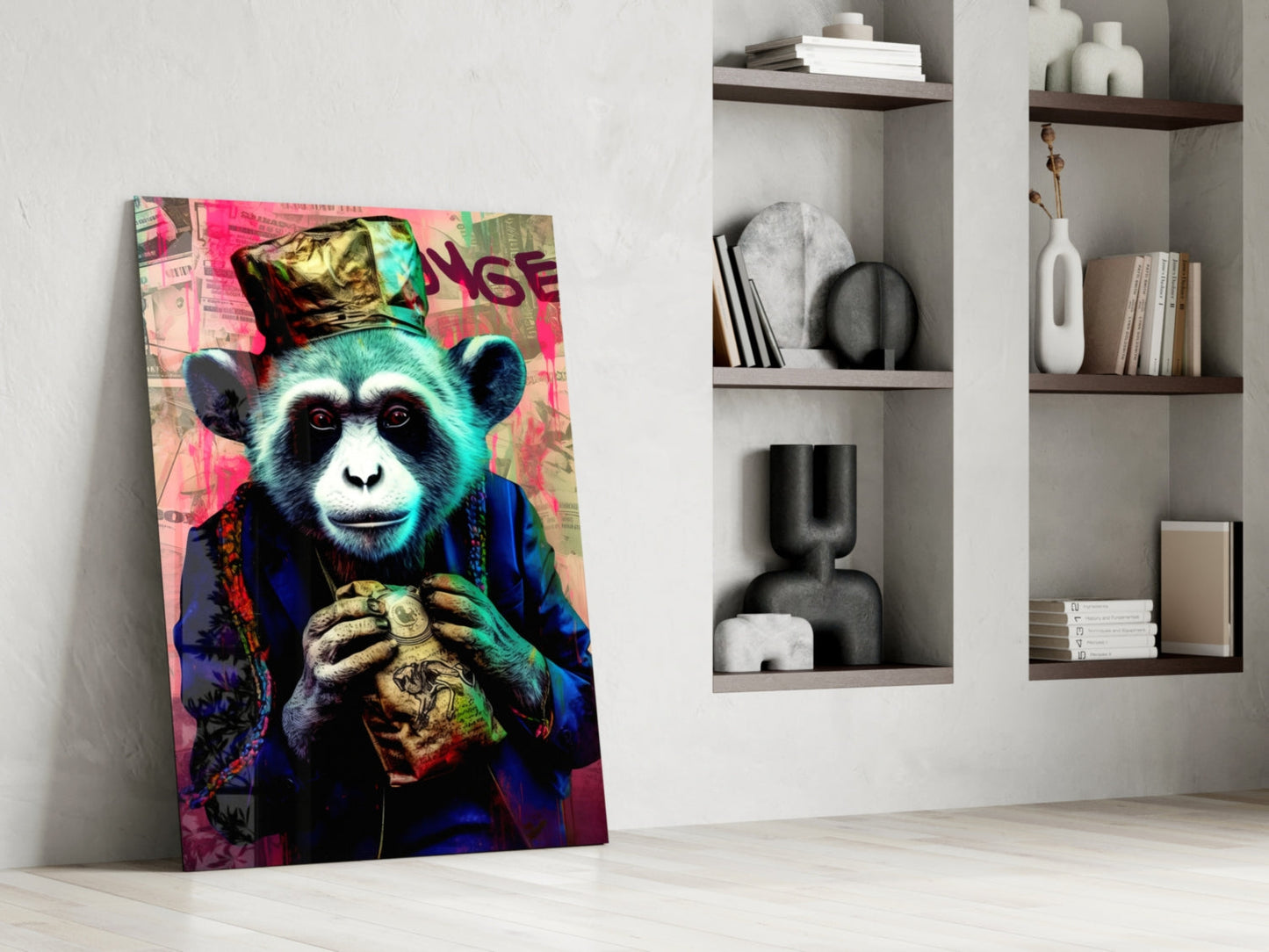 Vibrant pop art glass wall art of a stylized chimpanzee wearing a gold crown and blue jacket, leaning against white shelving with decorative objects.