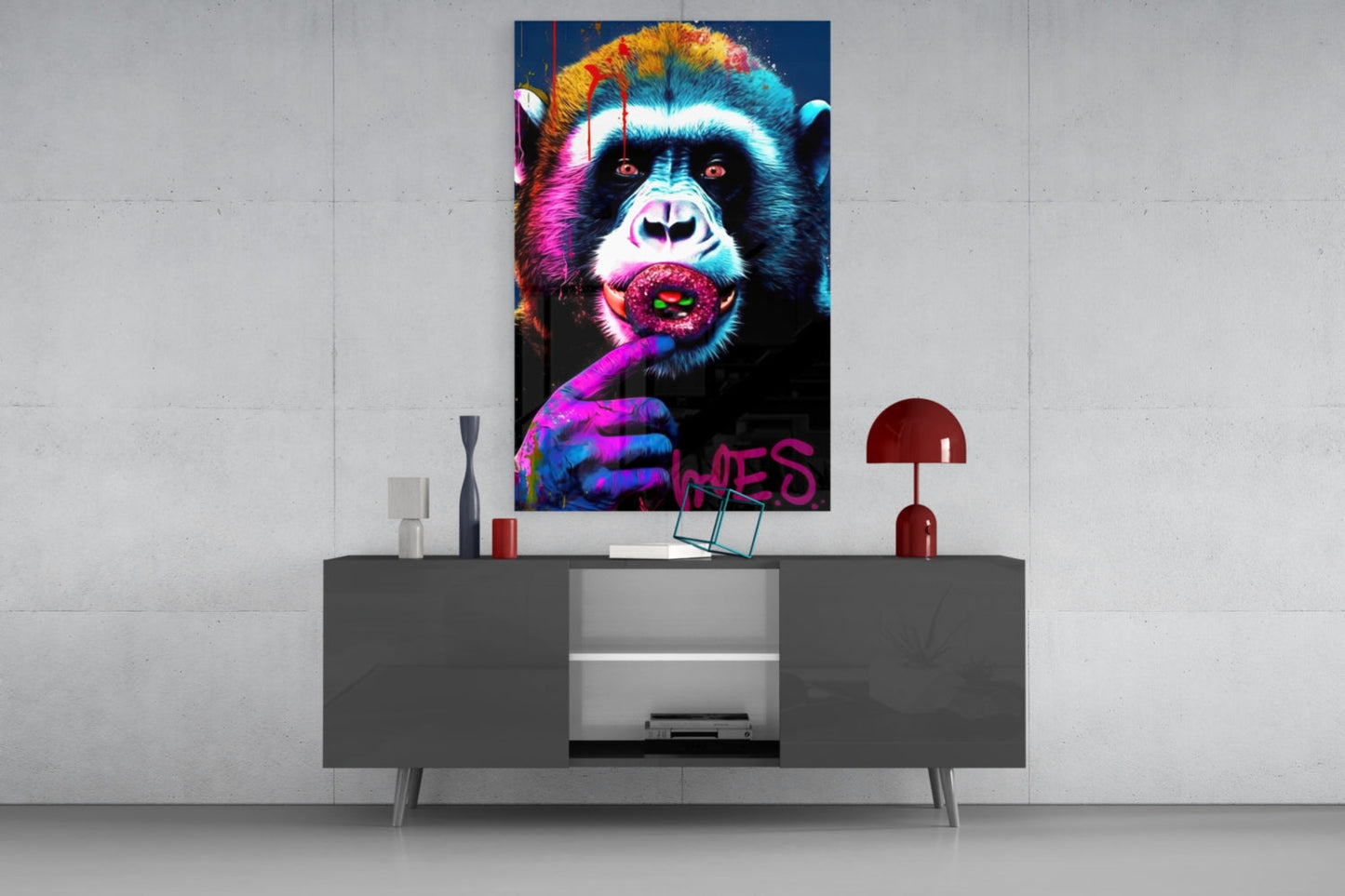 Vibrant pop art glass panel featuring a colorful chimp with rainbow fur holding a pink donut, displayed above a gray console table.