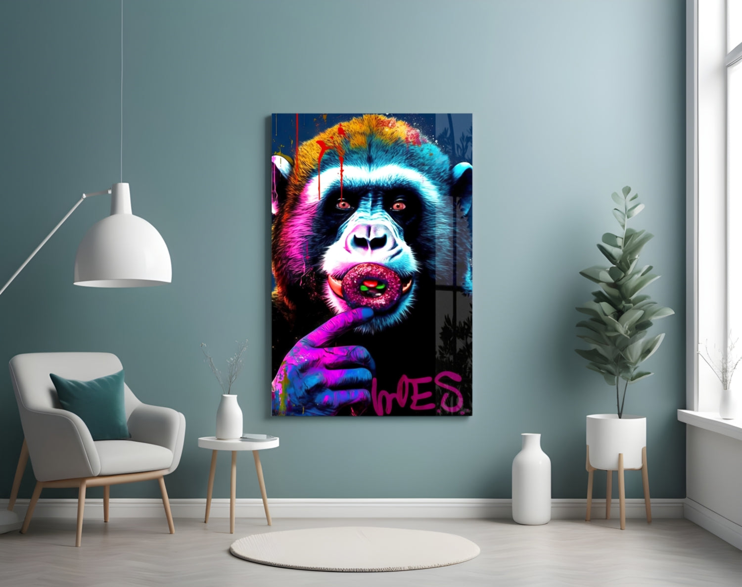 Vibrant pop art monkey glass wall art with neon colors hanging in minimalist room with chair and plants.