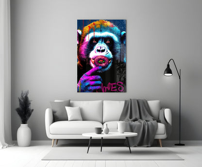 Vibrant pop art glass wall panel featuring a colorful chimp with neon pink, blue, and yellow tones displayed above a white sofa.