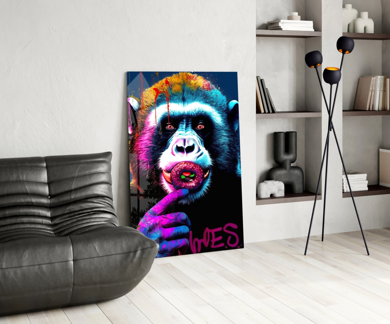 Vibrant pop art glass panel featuring neon-colored chimp with pink lips and "LOVES" text, displayed in modern living room beside gray sofa.