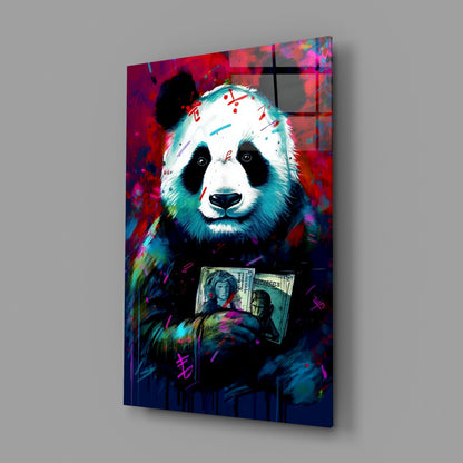 Colorful glass wall art displaying a vibrant panda holding dollar bills against a red and blue abstract background.