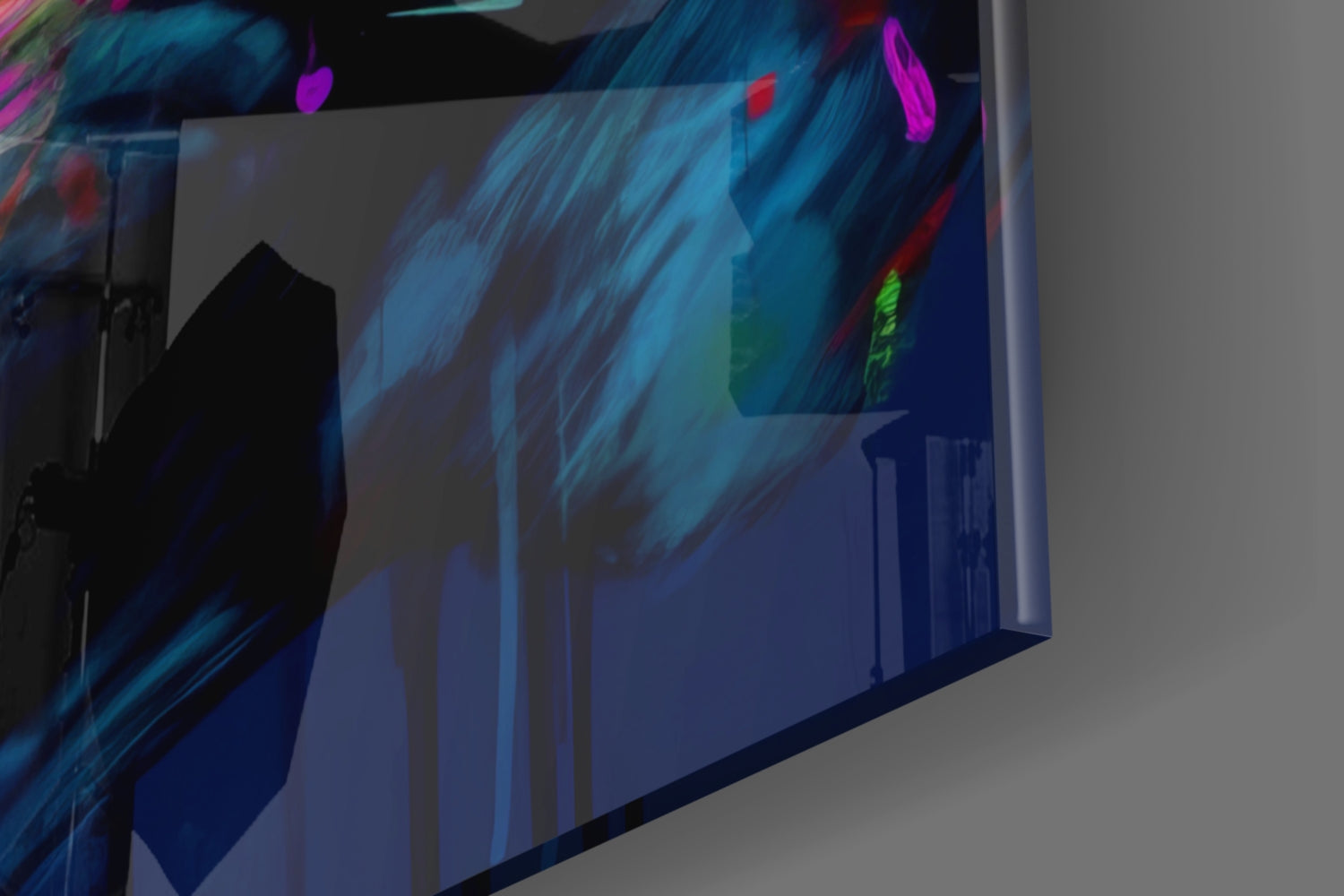 Close-up angled view of glass wall art displaying blue brushstroke patterns with colorful neon accents including magenta, red, and green highlights.