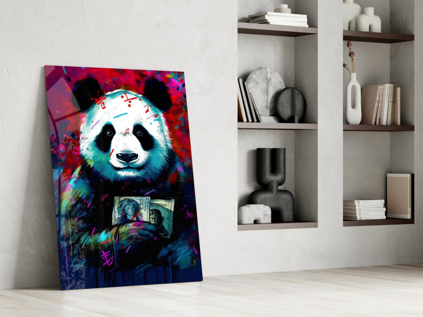 Colorful pop art panda holding money leans against white wall next to shelving unit with books and decorative objects.