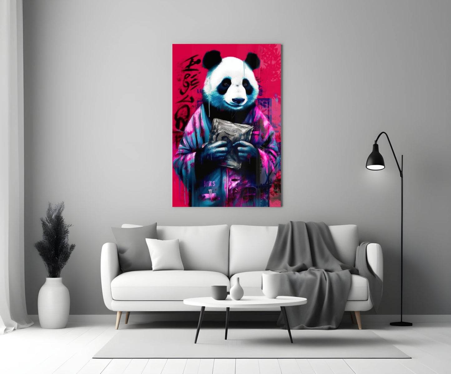 Vibrant pink panda glass wall art hanging above white sofa in modern living room setting.