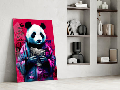Vibrant pop art panda canvas leaning against white wall beside modern shelving with decorative objects.