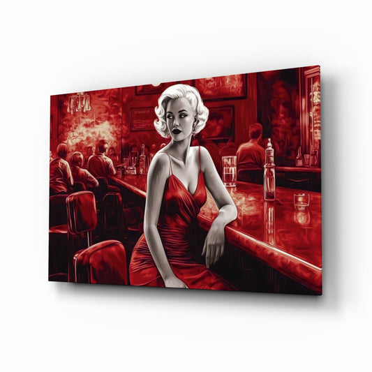 Glass wall art displaying a woman in red dress at a bar counter, shown at an angled perspective against white background.