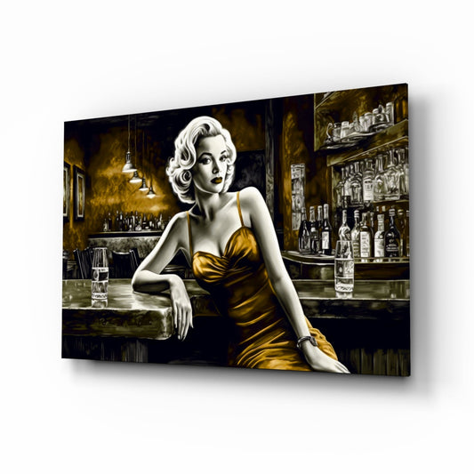 Glass wall art depicting a vintage-styled woman in a gold dress seated at a bar, displayed at an angle against white background.