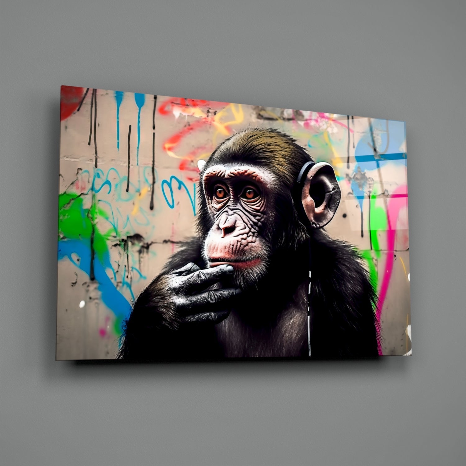 Chimpanzee wearing headphones against colorful graffiti background on glass wall art panel.