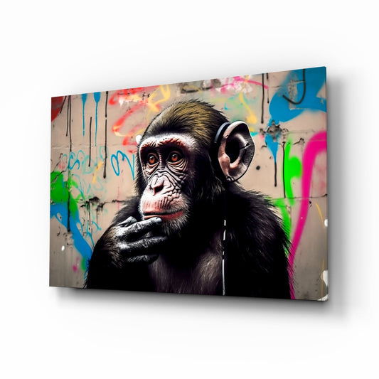 Chimpanzee wearing headphones with hand to chin against colorful graffiti background on glass wall art panel.
