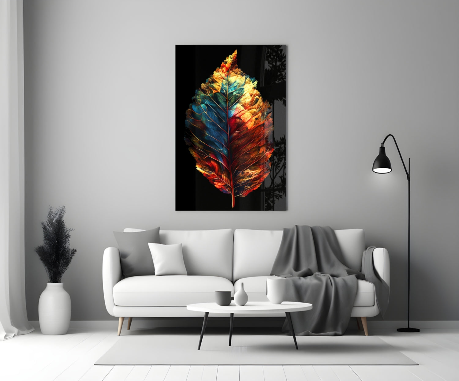 Colorful glass feather wall art with red, orange, yellow, and blue tones displayed above a white sofa in a modern living room.