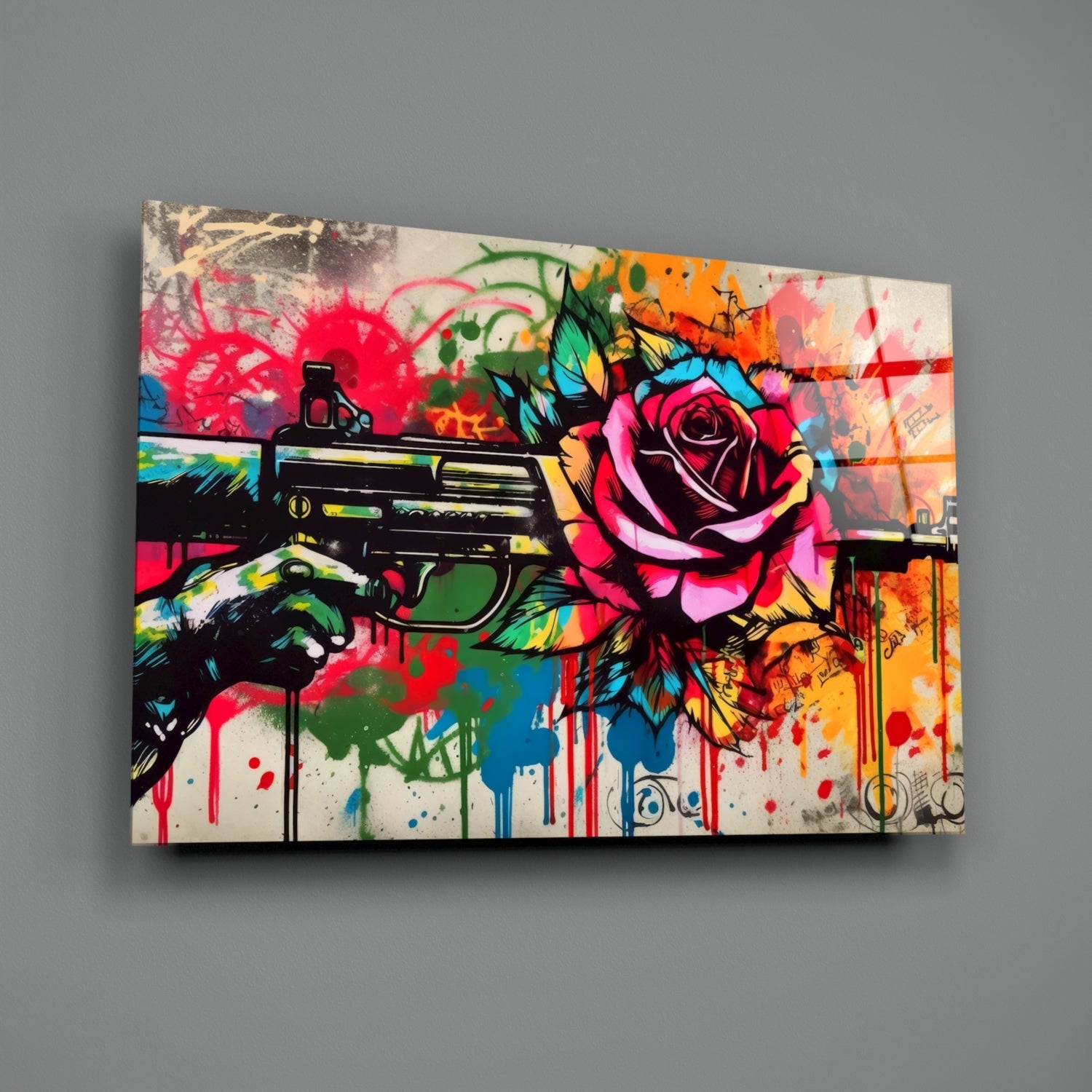 Vibrant glass wall art displaying a colorful pop art composition with a hand holding an assault rifle, pink rose, and splattered paint effects in red, blue, green, and orange tones against a cream background.