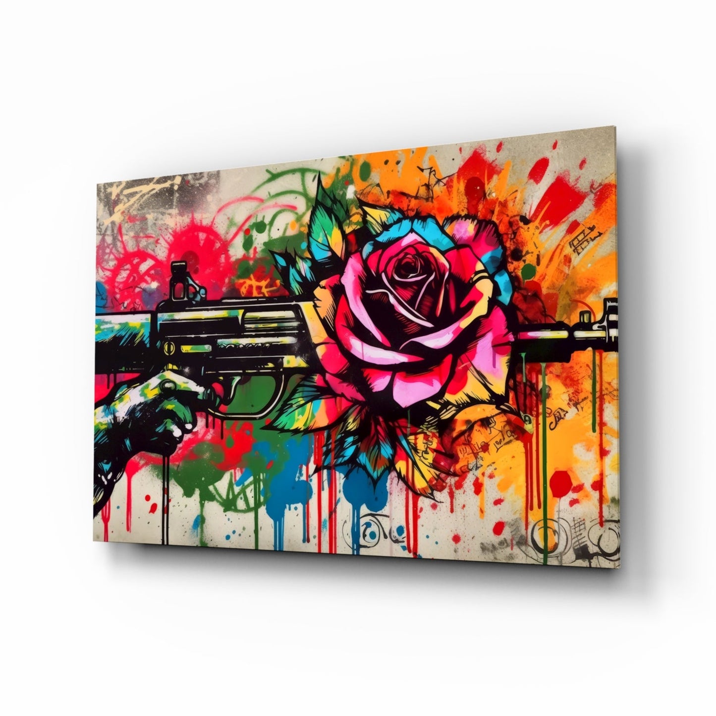 Angled perspective of glass wall art displaying vibrant street art with pink rose, revolvers, and colorful paint splatters on cream background.