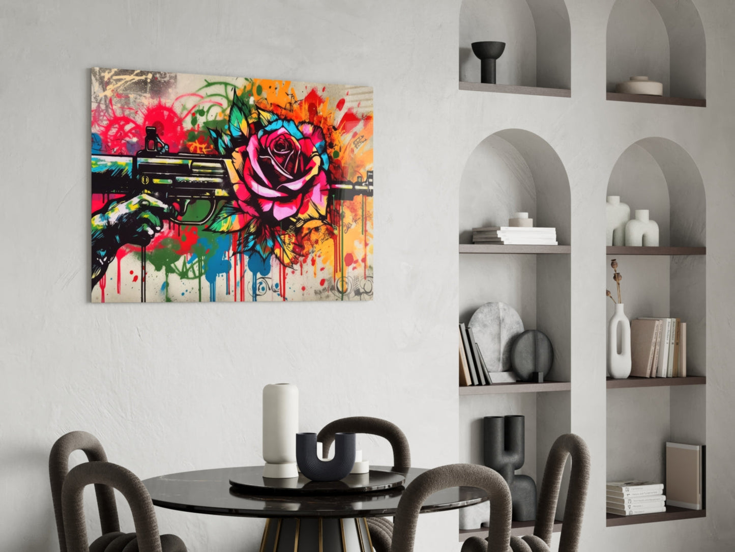 Vibrant street art canvas featuring colorful roses and a revolver displayed above a round black dining table with gray chairs.