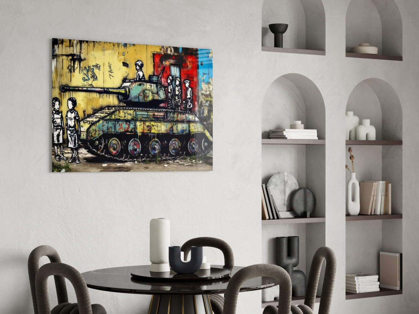 Vibrant street art glass wall panel depicting children and military tank in yellow, red, and blue tones, displayed above a dining table in modern interior.