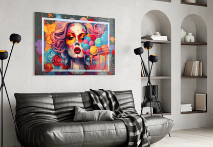 Colorful pop art portrait with vibrant hair and floating balloons displayed above black leather sofa in modern living room.