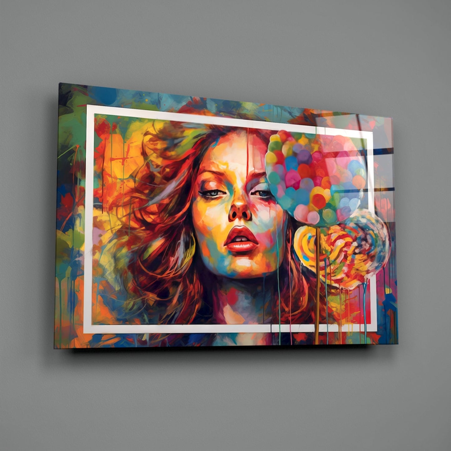 Vibrant glass wall art displaying colorful portrait of woman with red lips against multicolored abstract background, mounted on gray wall.