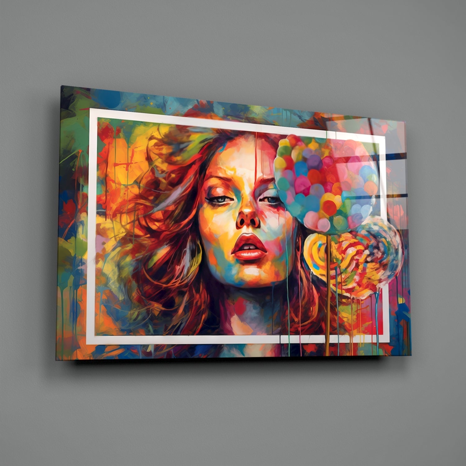 Vibrant glass wall art displaying colorful portrait of woman with red lips against multicolored abstract background, mounted on gray wall.