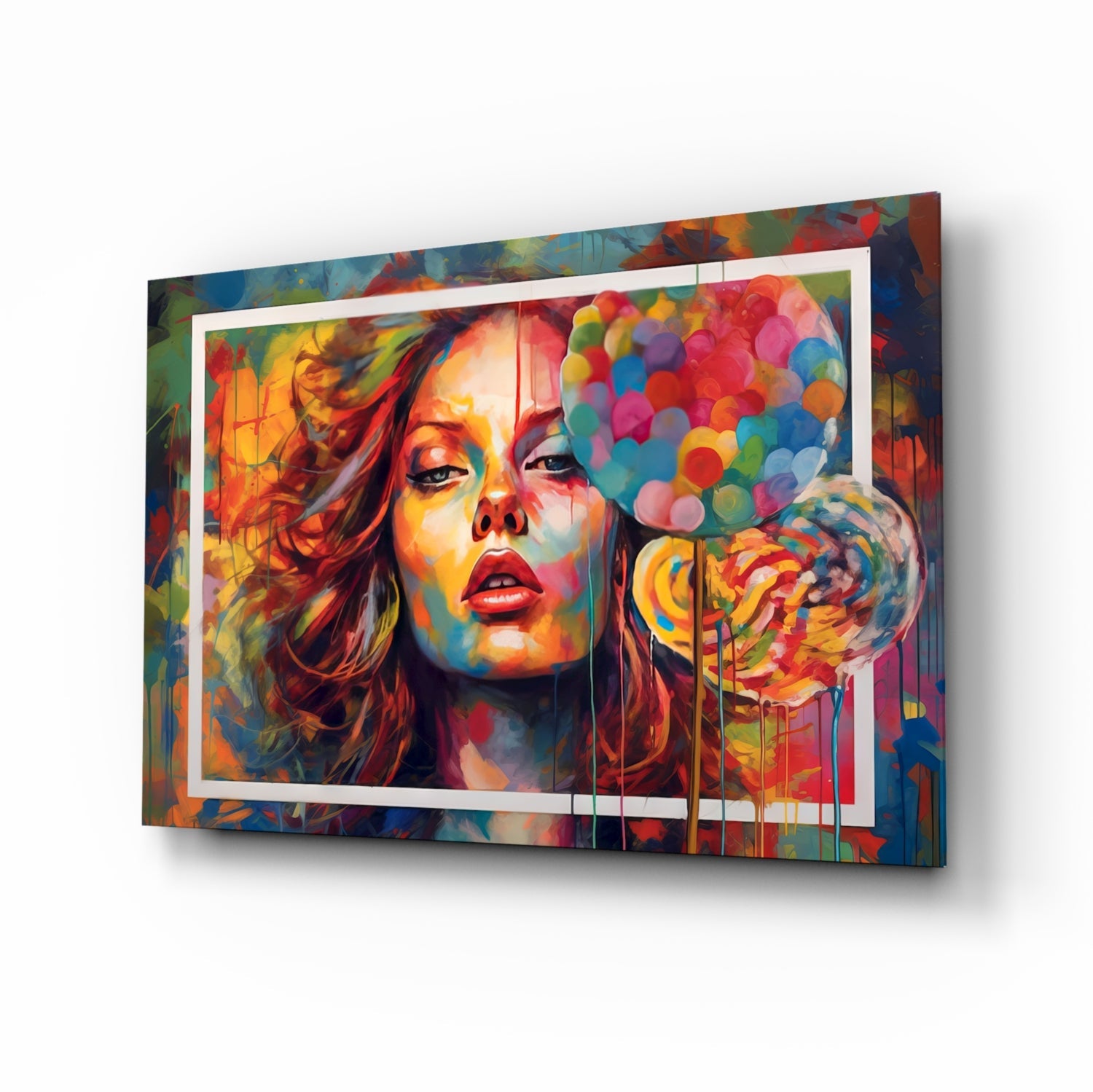 Angled 3D view of colorful glass wall art featuring vibrant portrait with red lips, rainbow circles, and white frame border against multicolored background.