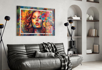 Colorful portrait glass wall art with white frame displayed above black leather sofa in modern living room interior.