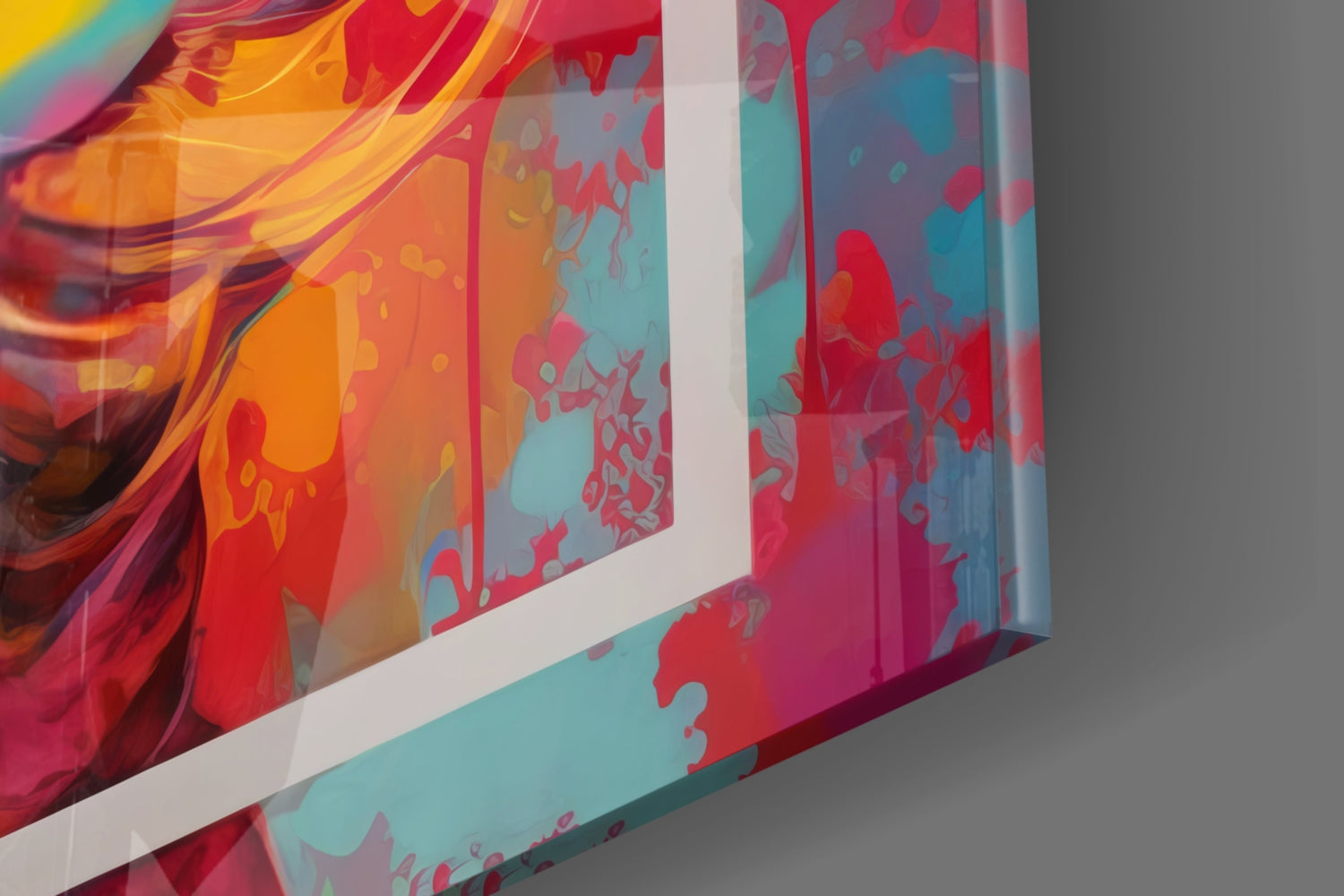 Close-up angled view of colorful glass wall art with red, orange, yellow, and turquoise abstract floral patterns and white frame edge.