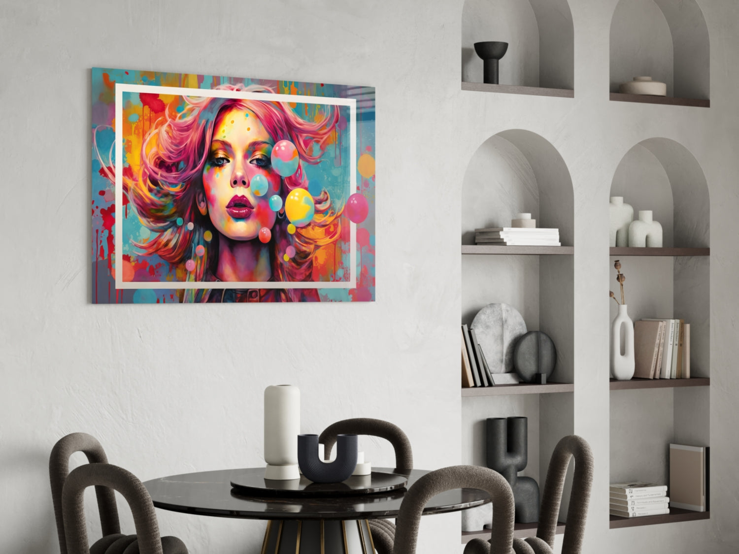 Colorful pop art portrait with vibrant pink hair and rainbow bubbles in white frame, displayed above dining table in modern interior.