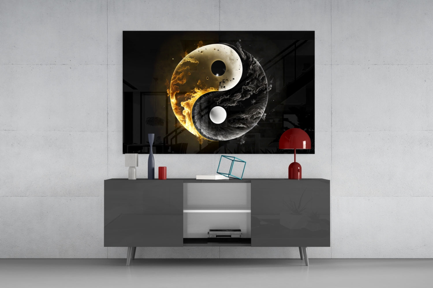 Yin-yang glass wall art with glowing gold and black swirled design displayed above gray media console in modern living room setting.