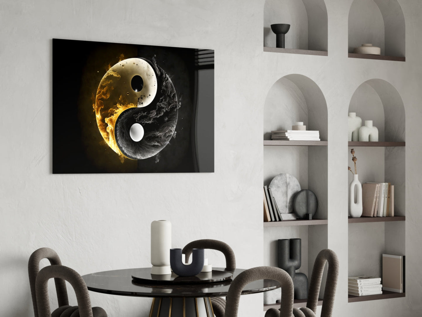 Ying Yang glass wall art with gold and black fire design displayed above a round black dining table in a modern interior setting.