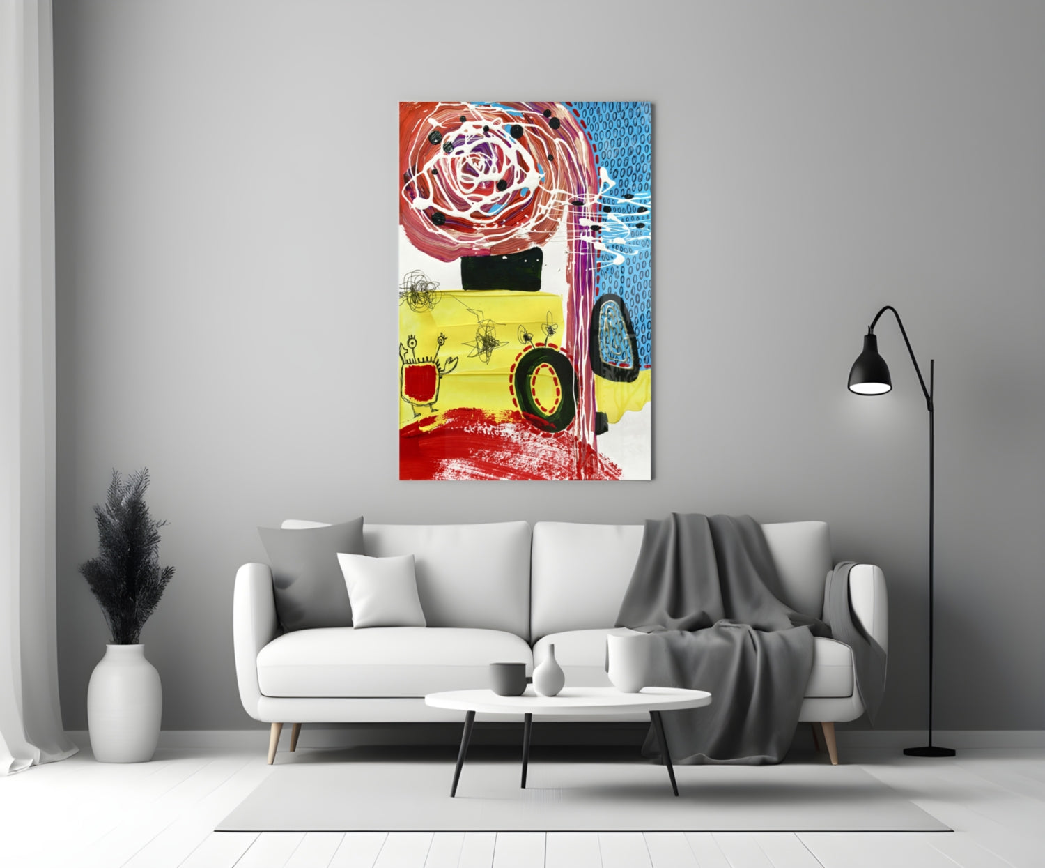Colorful abstract glass wall art featuring red rose, yellow section, and blue patterns displayed above white sofa in modern living room.