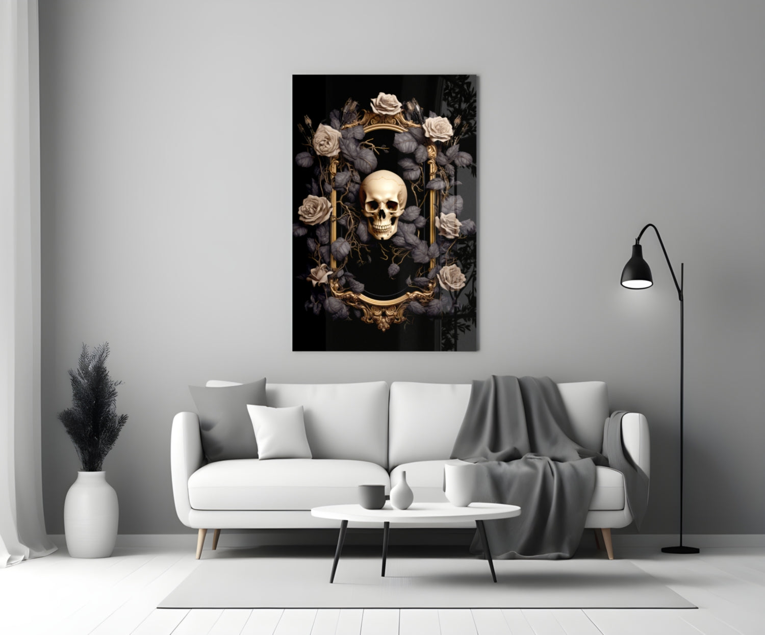 Gold-framed skull artwork surrounded by cream and grey roses on black background, displayed above white sofa in modern living room.
