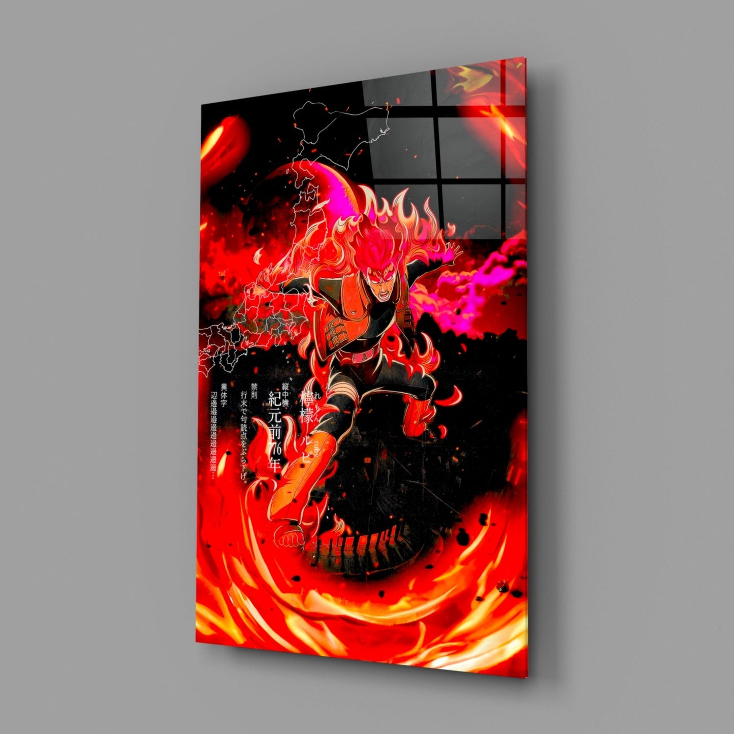 Angled view of glass wall art displaying a red and orange anime character surrounded by flames with Japanese text and map outlines.